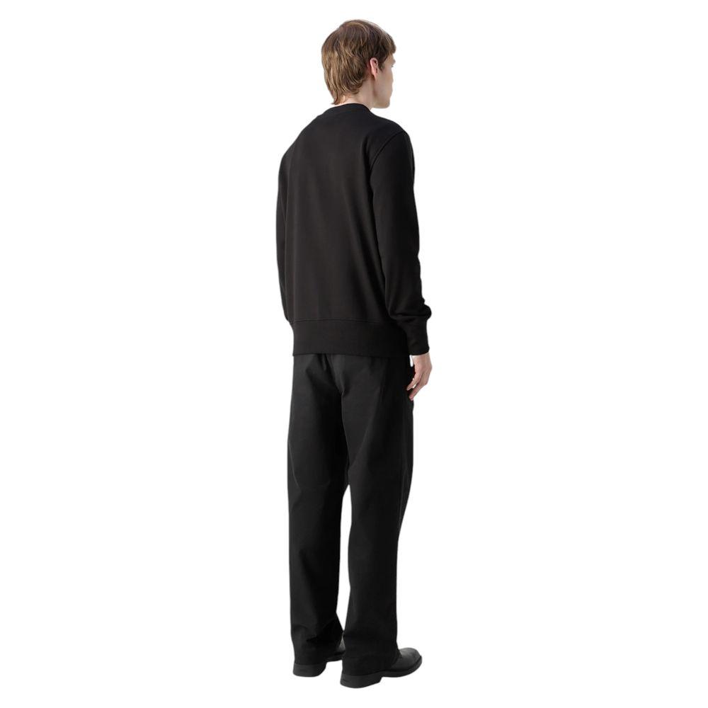 Back view of model wearing Calvin Klein Jeans black cotton sweater with minimalist design.
