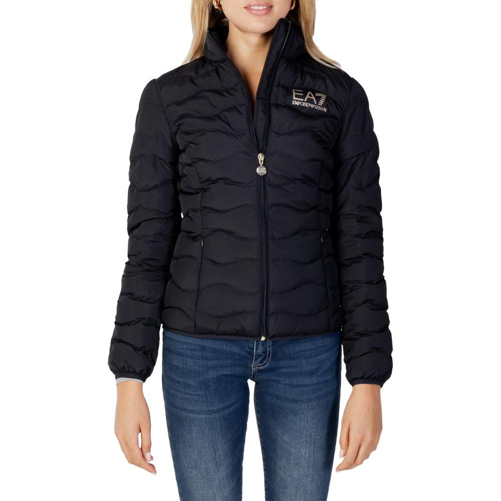Woman wearing EA7 Emporio Armani black polyester jacket, perfect for winter, showcasing style and warmth.