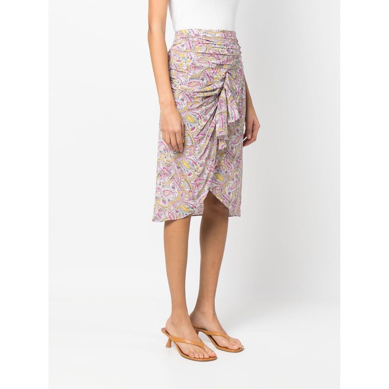 Model wearing IRO graphic-print beige knee-length skirt with draped and ruched detailing, showcasing ecru and pink silk blend.